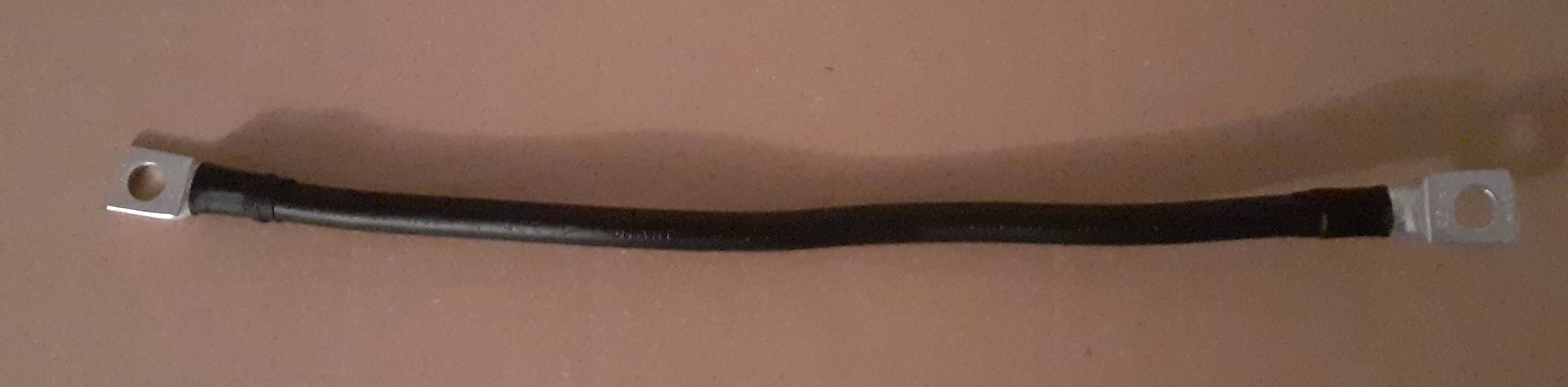 Propojovací kabel baterie s krytkou 25cm, 25mm2, 2x očko M8